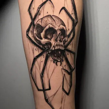 Neo-traditional spider skull tattoo on the arm, done at Blesink Tattoo Porto